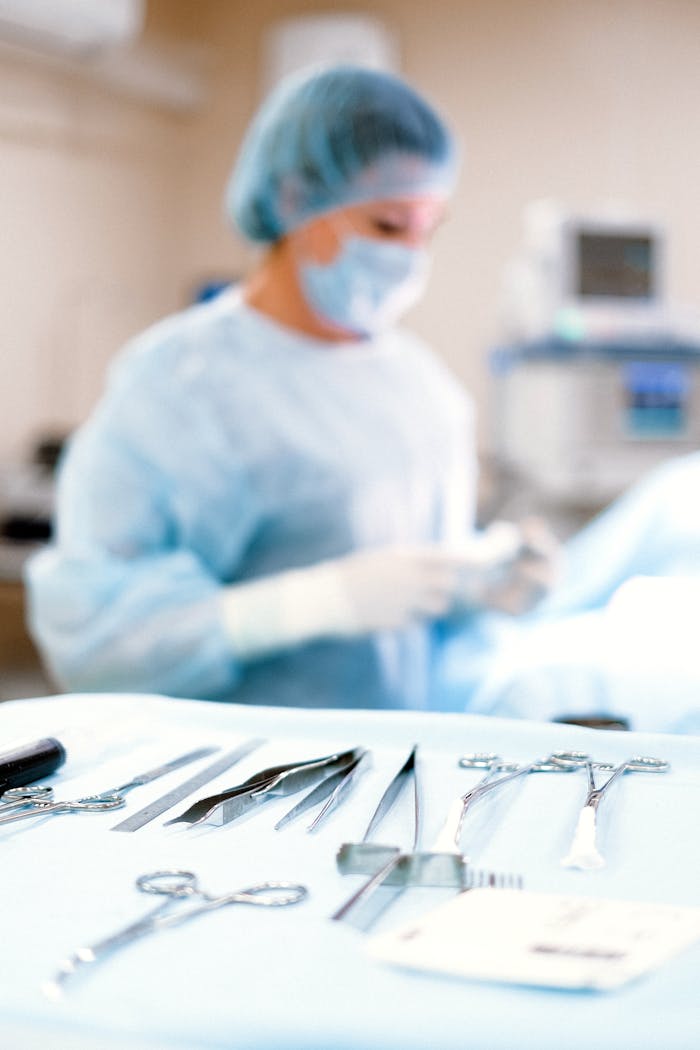 A medical professional in a sterile environment with surgical tools ready for operation.